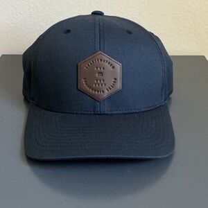Travis Mathew Navy Blue Hat with Brown Patch
